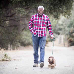 senior man walking a dog