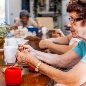 senior woman knitting