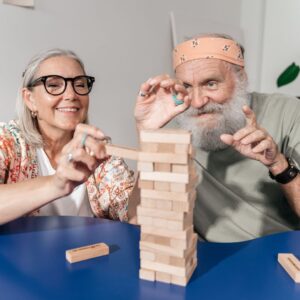 mature adults playing jenga