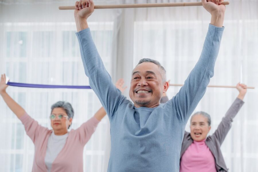 55 and over adults exercising in an active senior living community