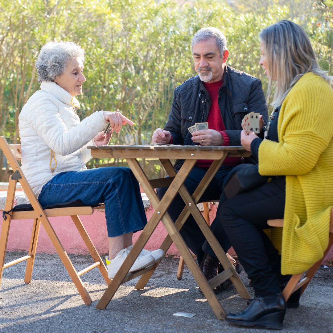 a group of friends playing cards