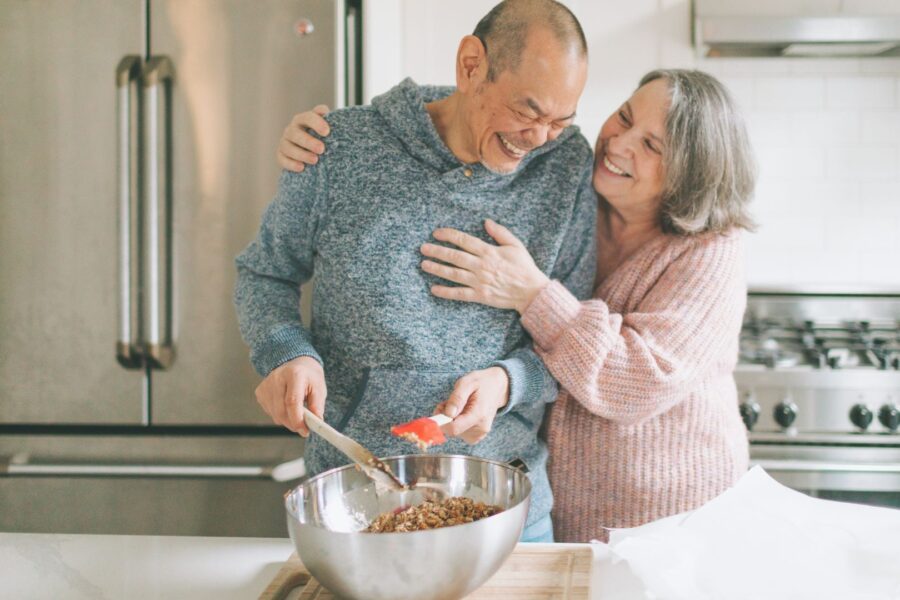 a couple having fun in the kitchen