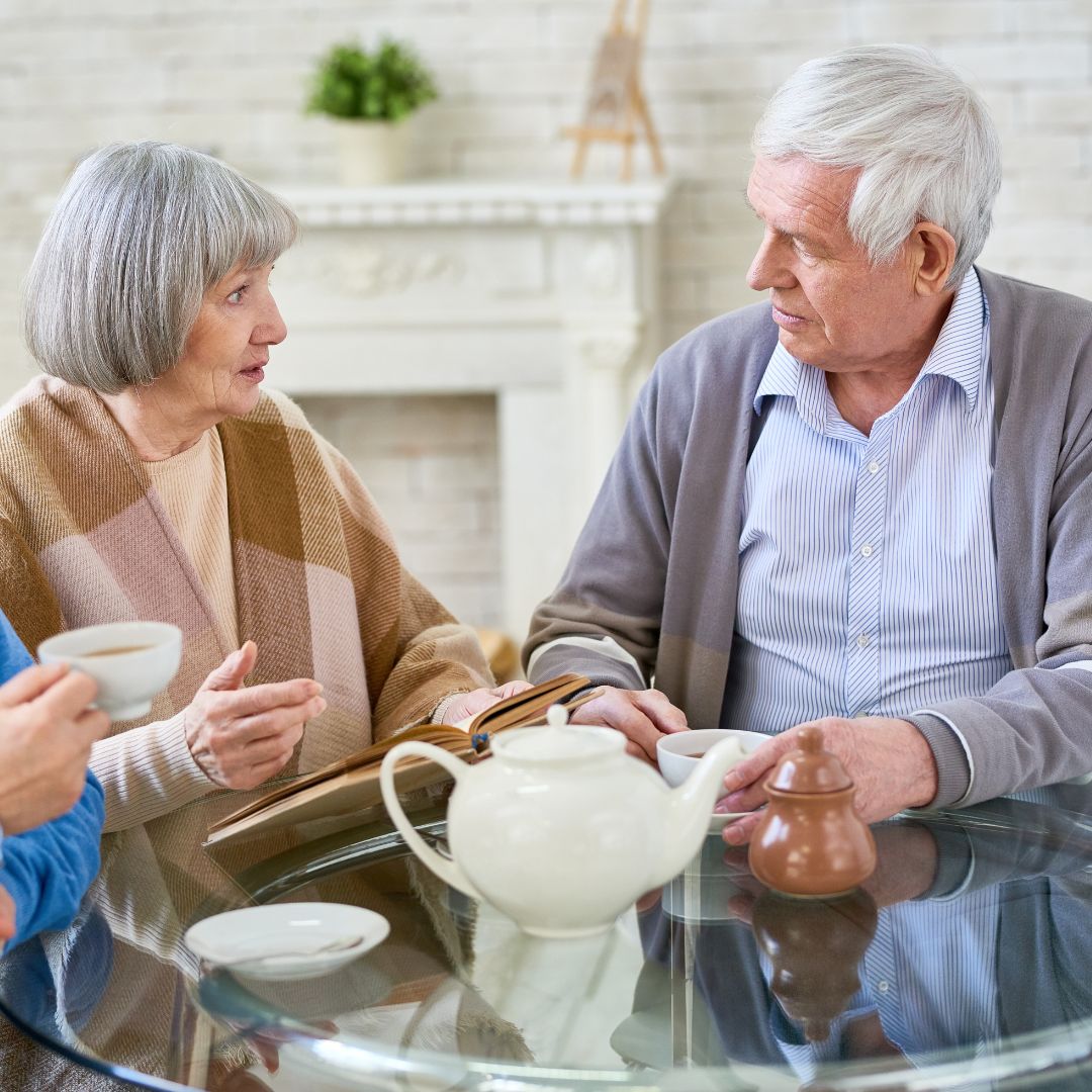 an older couple having tea