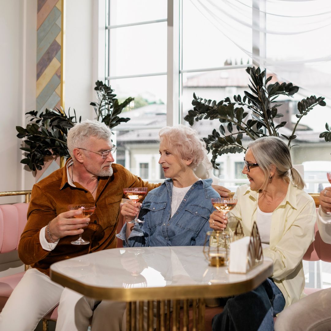 a group of seniors having a drink